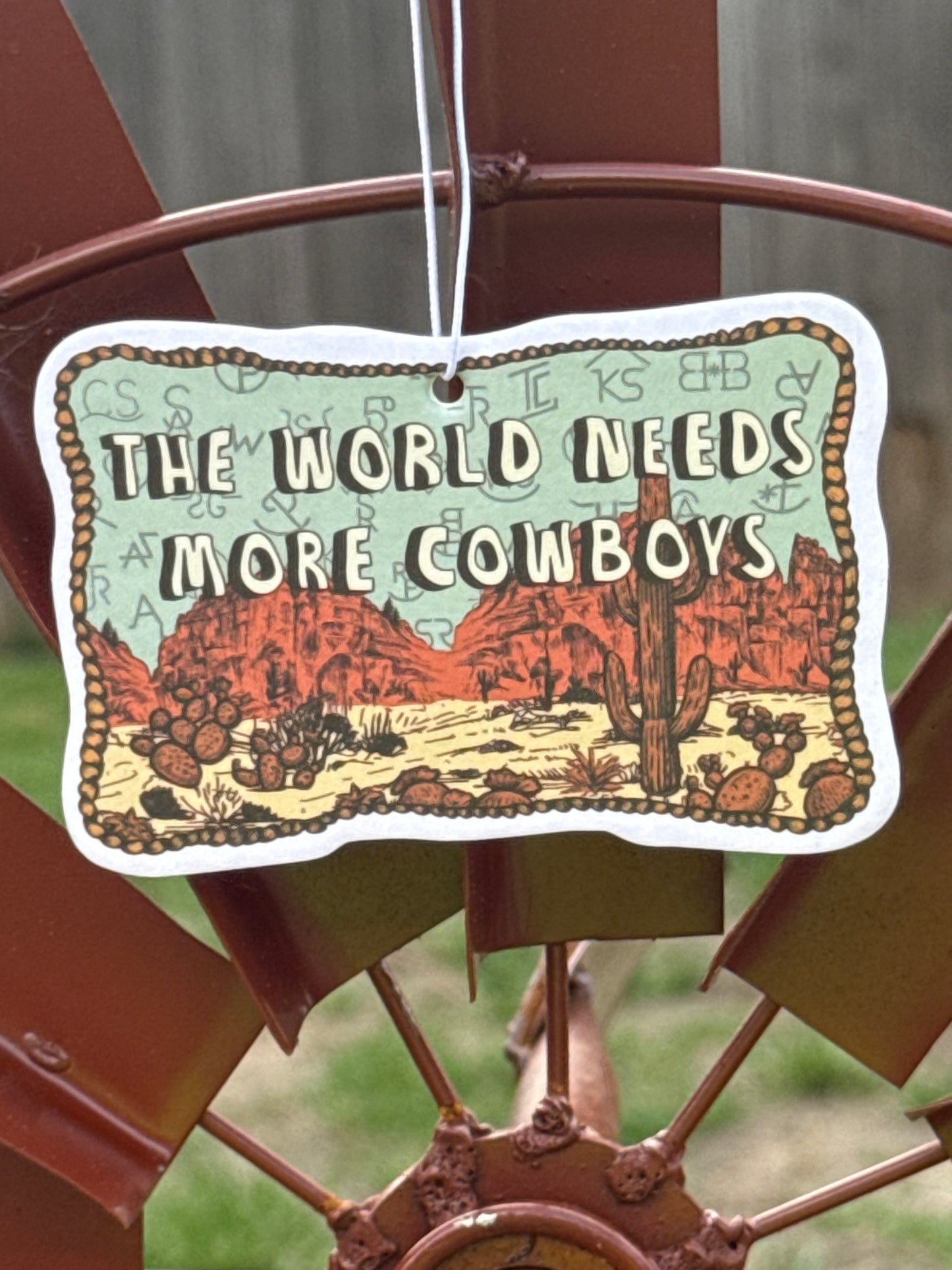 World needs cowboys air freshener