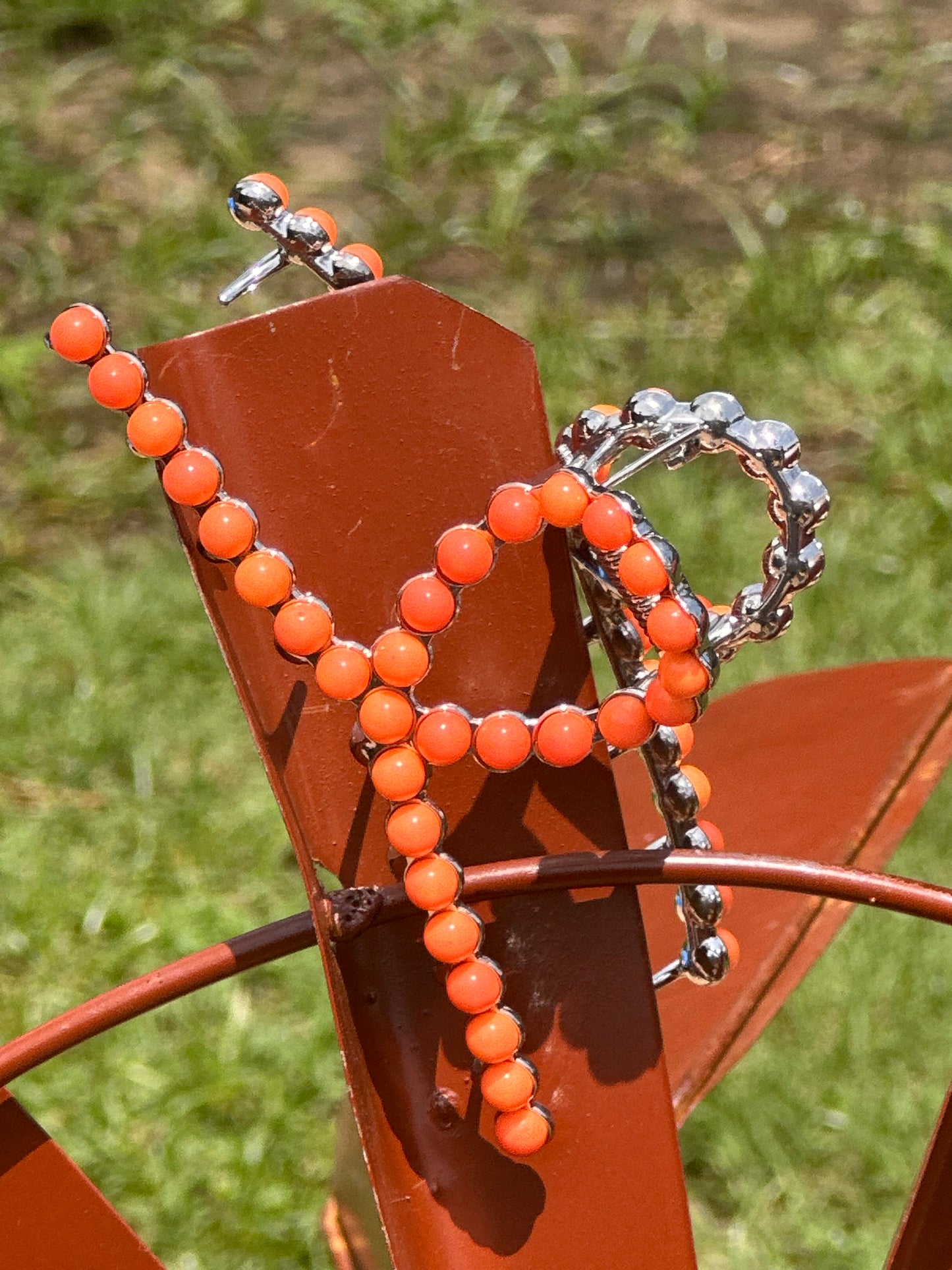 Orange metal claw clip